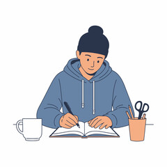 A young person in a blue hoodie and beanie writing in a notebook at a desk with a mug and stationery.