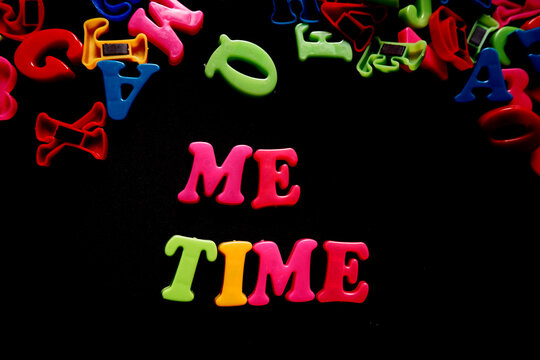 colorful 3d alphabet say me time on black background