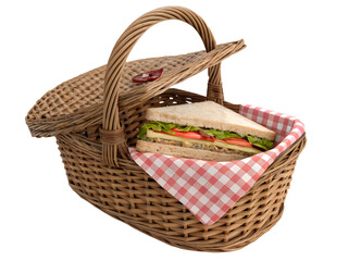 Healthy sandwich in a wicker picnic basket ready for outdoor dining