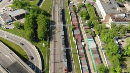 High drone angle above train line and city roads - Powered by Adobe