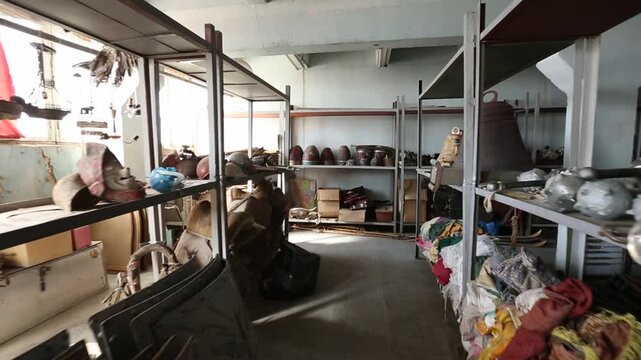 A montage featuring a large vintage wall clock sitting among clutter, followed by a pile of colorful, dusty rotary and push-button telephones in a storage space.