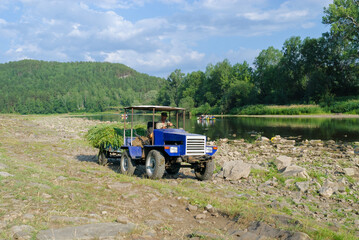 Fototapeta premium Beautiful view of a river winding through a canyon, with steep rocky walls and calm water. Soft natural light highlights textures and colors, creating a serene and dramatic landscape scene.