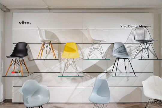 vitra furniture display featuring assorted modern chairs on shelves - Akureyri, Iceland - October 21 2025