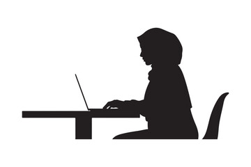 Silhouette of a person working on a laptop at a desk