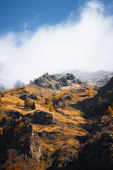snow over the mountains during autumn season