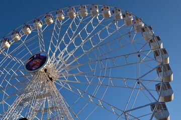 Ferris wheel. Observation. Ferris wheel with cabins for visitors. Attraction for viewing city from height. Gran Canaria. Canary Islands
