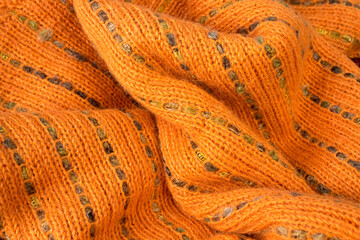 Knitted woolen sweaters. A bunch of knitted winter, autumn clothes, sweaters, knitwear, space for the text.