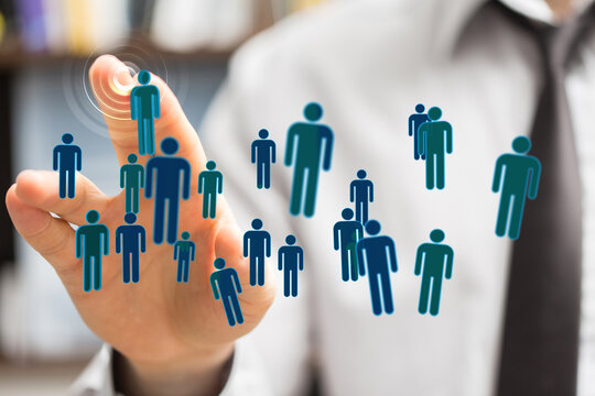 Abstract business concept, person touching digital human icons. Social connection, teamwork, and networking. Bu