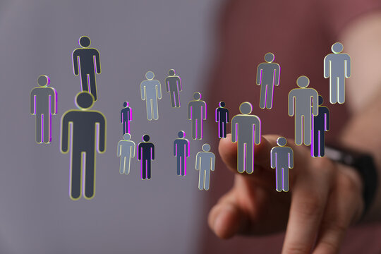 Connected digital people in a metaverse concept. Hand touching a virtual human network, representing communication and community. Technology, te