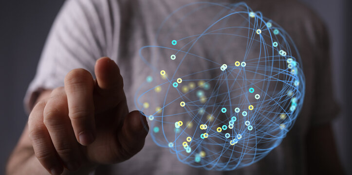 Person's hand touching a digital sphere symbolizing technology, globalization, and network. Perfect for illustrating concepts of innovation and