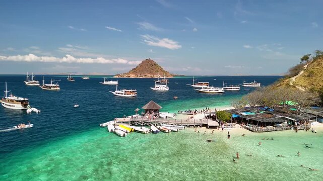 Beautiful panoramic drone view over Pulau Kelor Komodo showing crystal clear tropical ocean