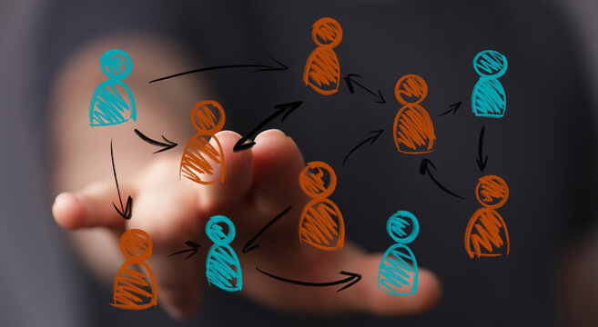 A human hand interacts with a digital network of interconnected person icons, symbolizing social connections, business hierarchy, and teamwork. - Powered by Adobe