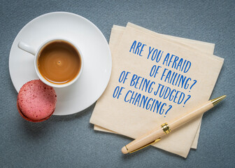 Are you afraid of failing? Or being judged? Or changing? Questions on a napkin with coffee.