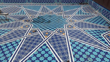 Decorative geometric mosaic pattern featuring shades of blue and white, suitable for background use