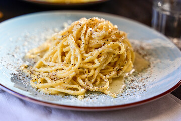 Fresh pasta    tonnarelli alla carbonara and Aperol Spritz  at  typical italian resaturant at Trastevere   neighbourhood at Rome 