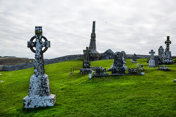 Old graves near the Rock of Cashel or Cashel of the Kings and St. Patrick Rock at Cashel, Ireland. Celtic crosses. 