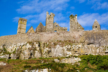 Castle the Rock of Cashel or Cashel of the Kings and St. Patrick Rock at Cashel, Ireland. Beautiful sunny weather with blue sky. 
