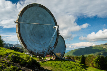 Giant Radio Dishes on Mountain Hillside - Weathered Parabolic Antennas in a Scenic Landscape
