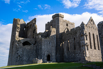 Castle the Rock of Cashel or Cashel of the Kings and St. Patrick Rock at Cashel, Ireland. Beautiful sunny weather with blue sky. 