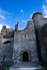 Castle the Rock of Cashel or Cashel of the Kings and St. Patrick Rock at Cashel, Ireland. Beautiful sunny weather with blue sky. 