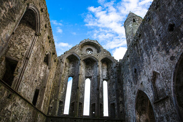 Inside the Castle the Rock of Cashel or Cashel of the Kings and St. Patrick Rock at Cashel, Ireland. Blue sunny sky. 