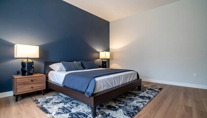 Deep Navy and Walnut Bedroom With Sculptural Lamps