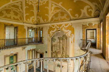 Abandoned Baroque Interior with Fresco Mural and Rusted Balcony Railings