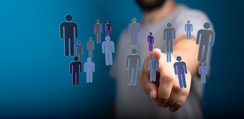 Concept of digital networking, community, and global connection. A person interacts with virtual human icons, symbolizing connection and unity i