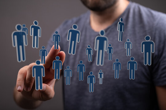 Person touching digital people icons. Concept of connection, networking, recruitment, human resources, teamwork