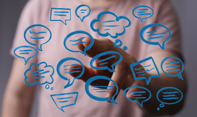 An image capturing a person's interaction with digital speech bubble icons, highlighting communication and virt