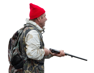 A hunter with a gun in camouflage clothing. A senior man with a gun, medium shot, searching for game.