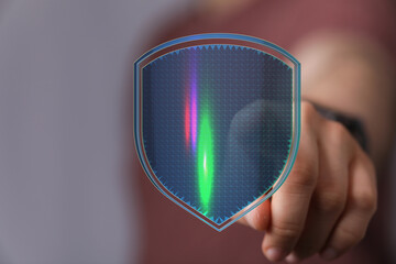 Abstract futuristic digital shield concept held by a hand. Protection, security, innovation. Perfect for technology and cybersecurity