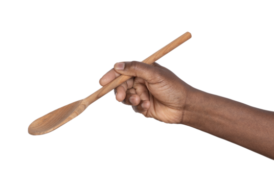 Hand holding a wooden spoon isolated on white or transparent background