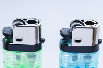 Two Colorful Disposable Lighters With Translucent Plastic Bodies