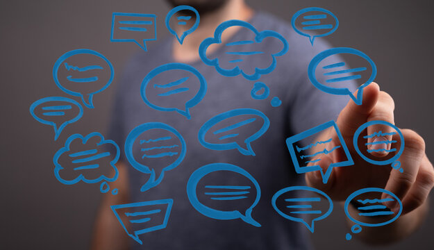 Concept of communication through technology. Person interacting with floating chat icons, symbolizing dialogue