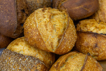 Fresh bread from the oven at a small artisan bakery at home. Very healthy sourdough bread products of various types. 