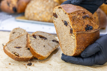 Fresh bread from the oven at a small artisan bakery at home. Very healthy sourdough bread products of various types. 