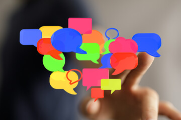 An image with speech bubbles in the air, a metaphor of social network, communication, concept of chat, speaking
