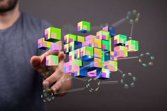 An image of person interacting with digital abstract colorful cubes. Representing technology, data, connection,