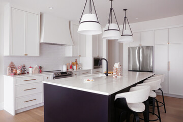 Christmas gingerbread theme decor and cookware display in a beautiful modern white and black tone kitchen