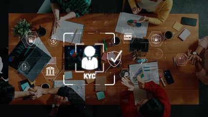 A diverse group of professionals engage in a business meeting focused on the KYC process, surrounded by technology and digital icons representing identity and finance. Raster - Powered by Adobe