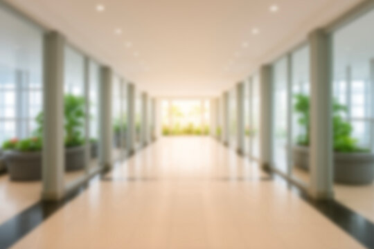 Bright modern office corridor,  blur luxury hotel lobby and lounge for background contemporary interior design, glass walls and indoor plants creating a clean professional business environment