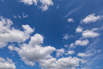 Fluffy Clouds And Blue Sky Background
