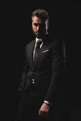 Confident man standing with hand in pocket