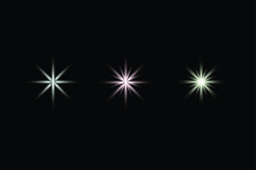 Fototapeta premium Trio of Colorful Starburst Light Effects on Black Background