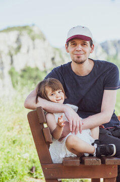 A father and a daughter are having a great time in nature

