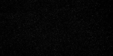 Snow particle overlay featuring minuscule white flakes scattered across a solid dark black background