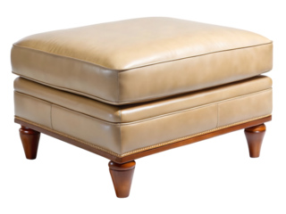A luxurious tan leather ottoman with decorative nailhead trim and carved wooden legs, isolated on transparent background