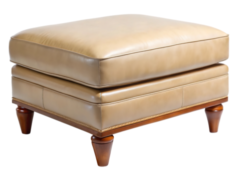 A luxurious tan leather ottoman with decorative nailhead trim and carved wooden legs, isolated on transparent background
