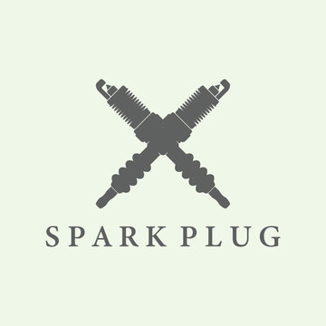 Two crossed spark plugs and the word sparkplug underneath